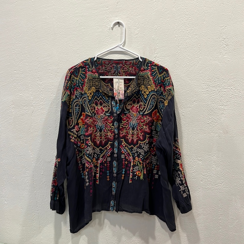 This is a Johnny Was shirt. Embroidered and made of silk.
